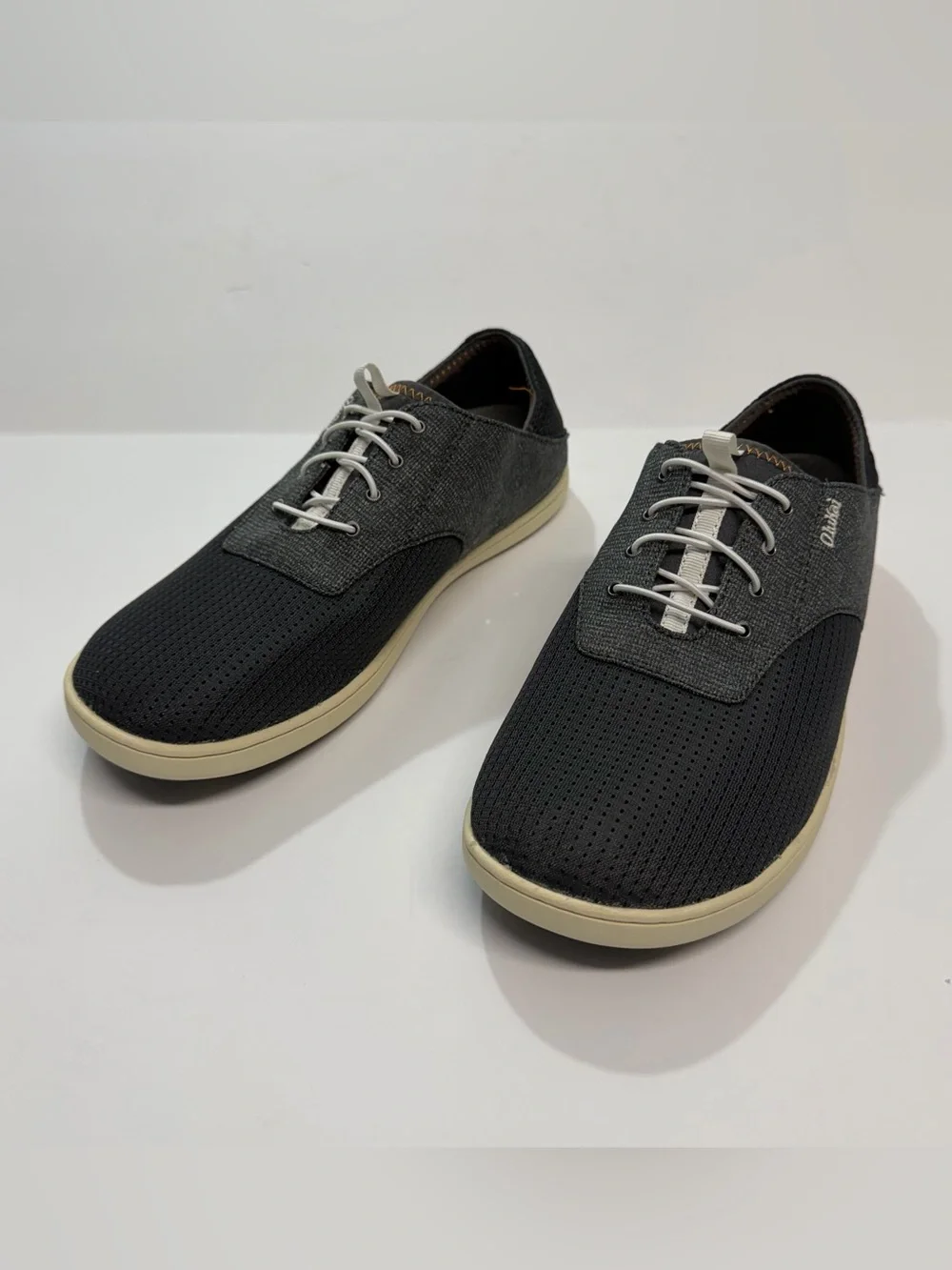 OluKai Men's Black and Cream Casual Perforated Slip-On Sneakers
